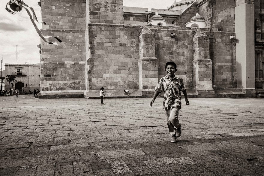Oaxaca Street Photography, Boy chasing ball, Oaxaca Cathedral, Fuji X-Pro2, Fuji 23mm f2, black and white
